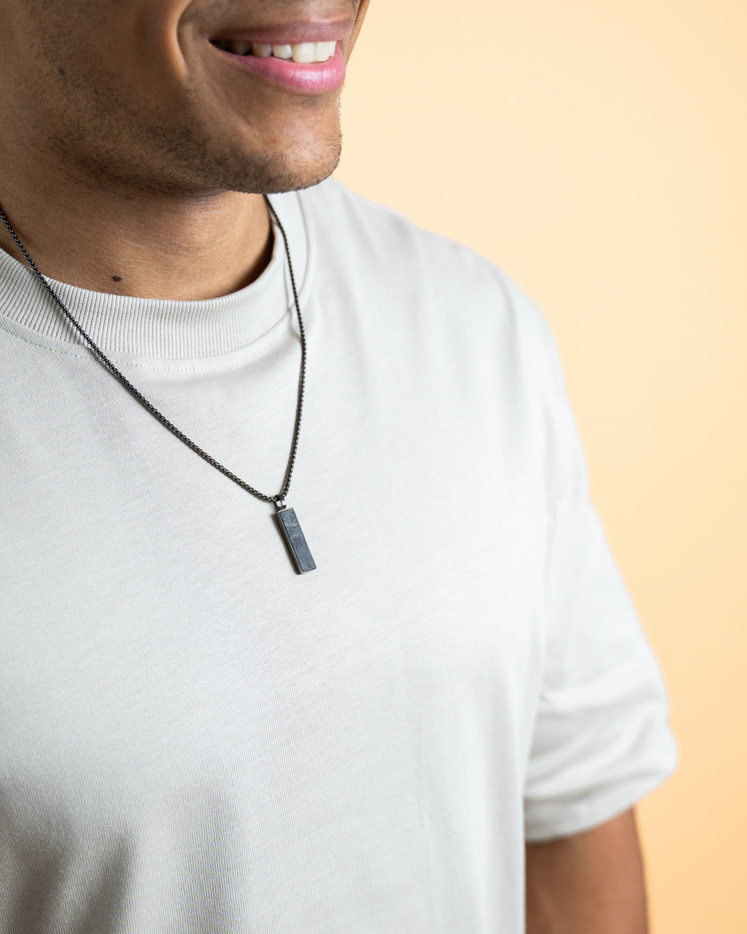 Black stainless steel necklace with a forged carbon finish