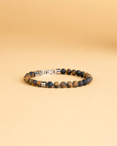 Bracelet avec pierre oeil de tigre mat de 6 mm et élément en titane