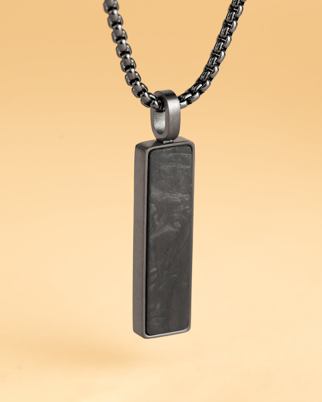 Black stainless steel necklace with a forged carbon finish