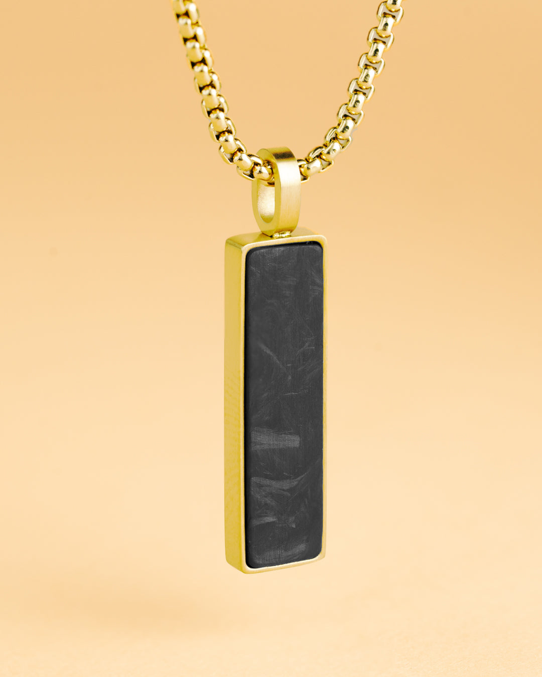 Gold-plated stainless steel necklace with a forged carbon finish