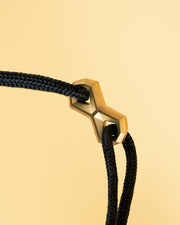 1.5mm Black nylon bracelet with a gold-plated Infinity sign