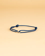 Bracelet en nylon bleu de 1,5 mm avec un signe d'infini en titane
