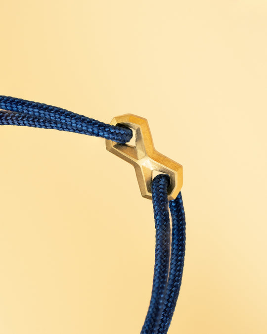 1.5mm Blue nylon bracelet with a gold-plated Infinity sign