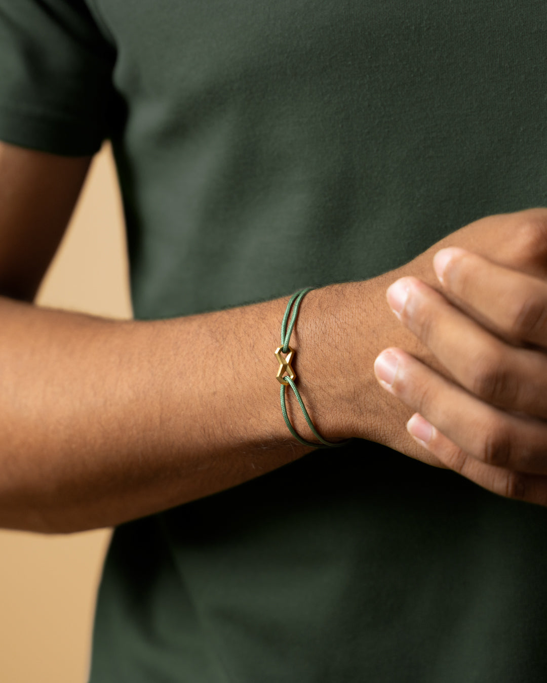 1.5mm Green nylon bracelet with a titanium Infinity sign