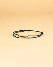 1.5mm Black nylon bracelet with a gold-plated carbon element