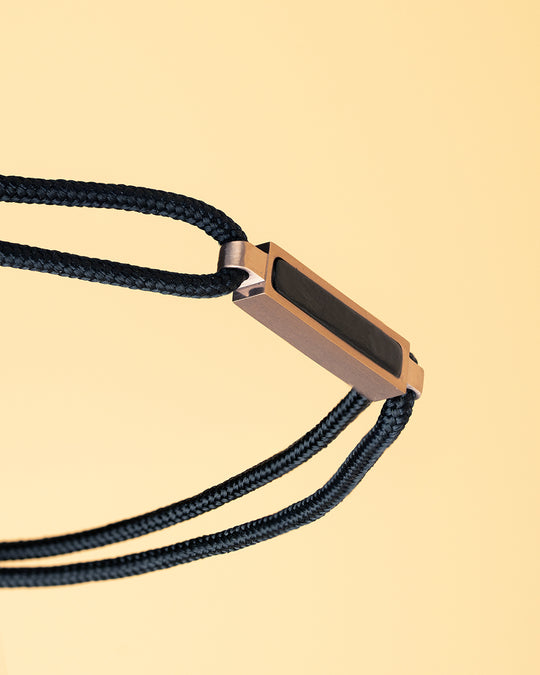 1.5mm Black nylon bracelet with a bronze-plated carbon element