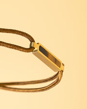 Bracelet en nylon marron 1,5 mm avec une pierre Oeil de Tigre en titane
