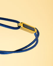 1,5 mm blauwe nylon armband met een verguld blauw tijgeroogelement